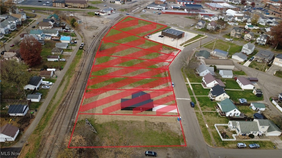 Aerial perspective of suburban area featuring property boundaries highlighted