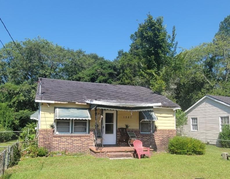 Bungalow-style home featuring a front lawn
