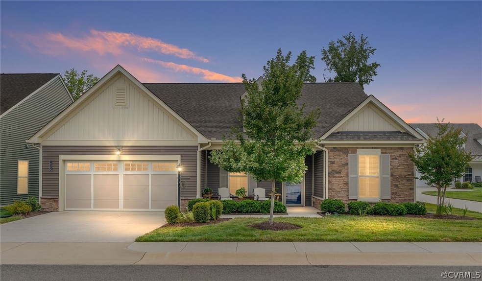 Twilight photo of the exterior front of the home