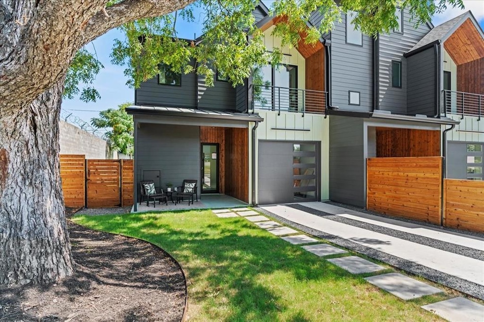 Rear view of property featuring a balcony and an 