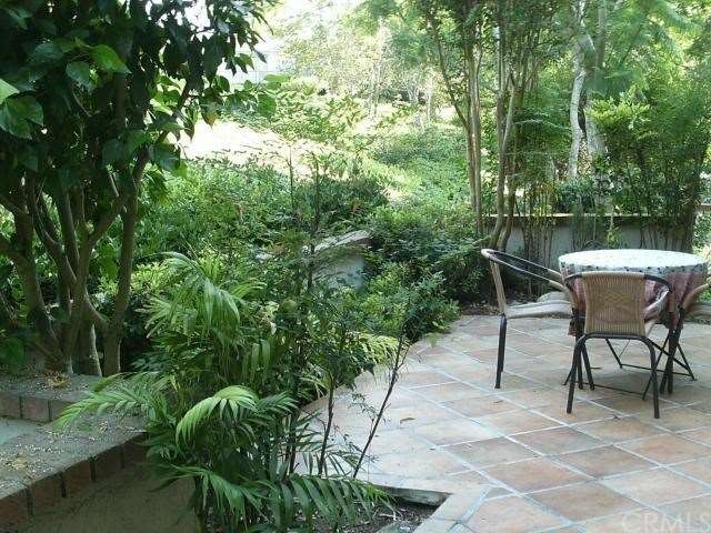 Gorgeous view of greenery and lushly landscaped sl