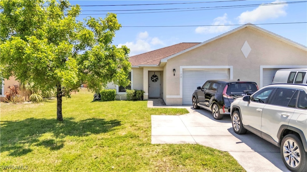 View of front of home featuring a garage, stucco s