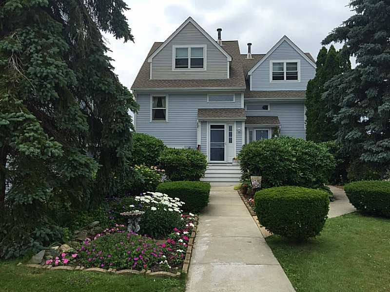 Exterior Front. END UNIT, PRETTY GARDENS LEAD UP T