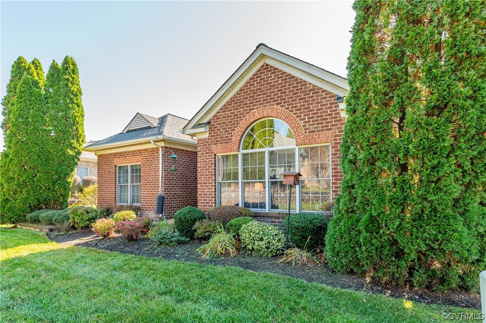 View of property featuring a front lawn