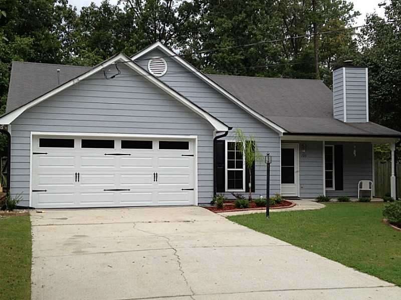 Exterior Front. Carriage-style garage door and Fro