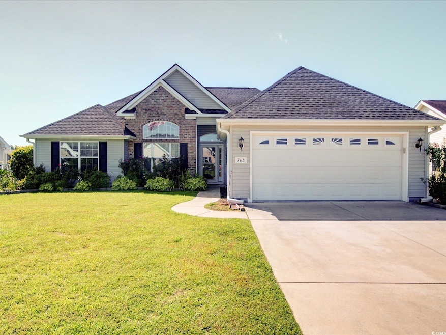 Ranch-style home with driveway, a garage, a front yard, and a shingled roof