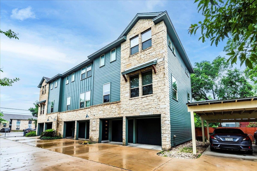 View of front facade featuring stone siding and d
