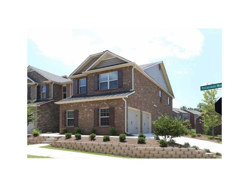 Exterior Front. Brick 4 bedroom townhome with side
