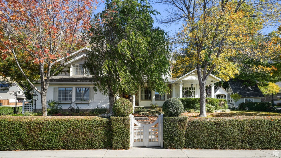 View of front facade with a fenced front yard and a gate