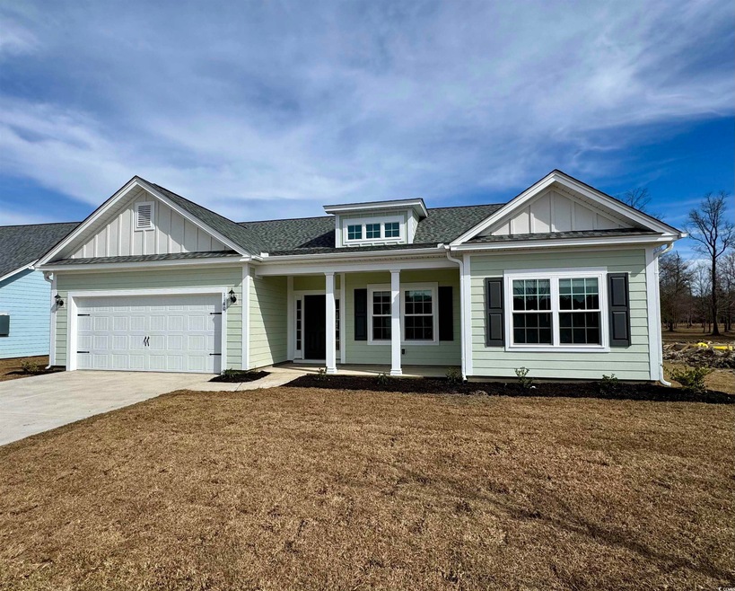 View of front facade with driveway, a garage, a fr