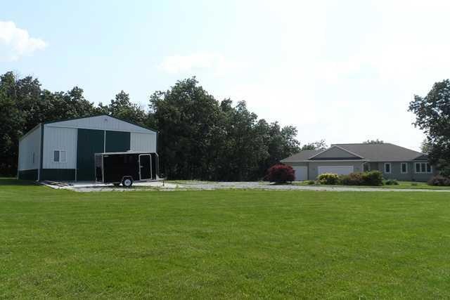 Exterior Front. View from 225th Trl Driveway entry