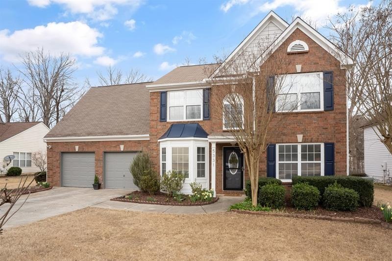 Updated brick front 4 bedroom home on large level 
