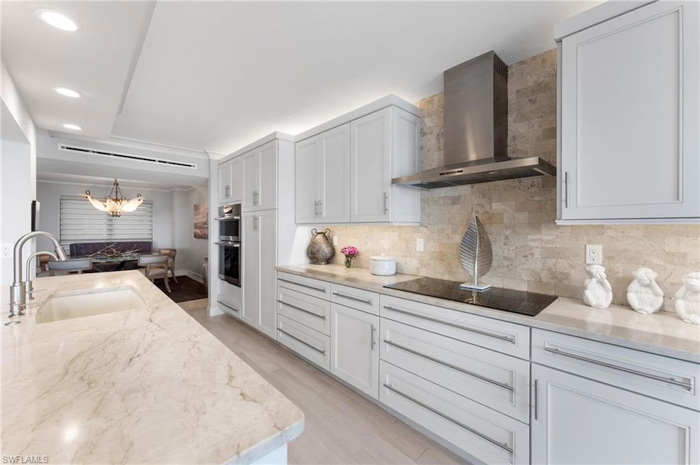 Kitchen with sink, wall chimney exhaust hood, ligh