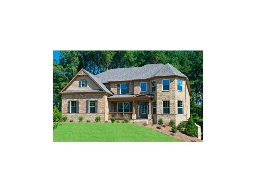 Exterior Front. 4 sides brick with stone accent an