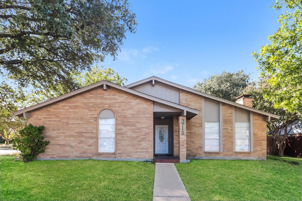 Single story home with an enhanced front lawn