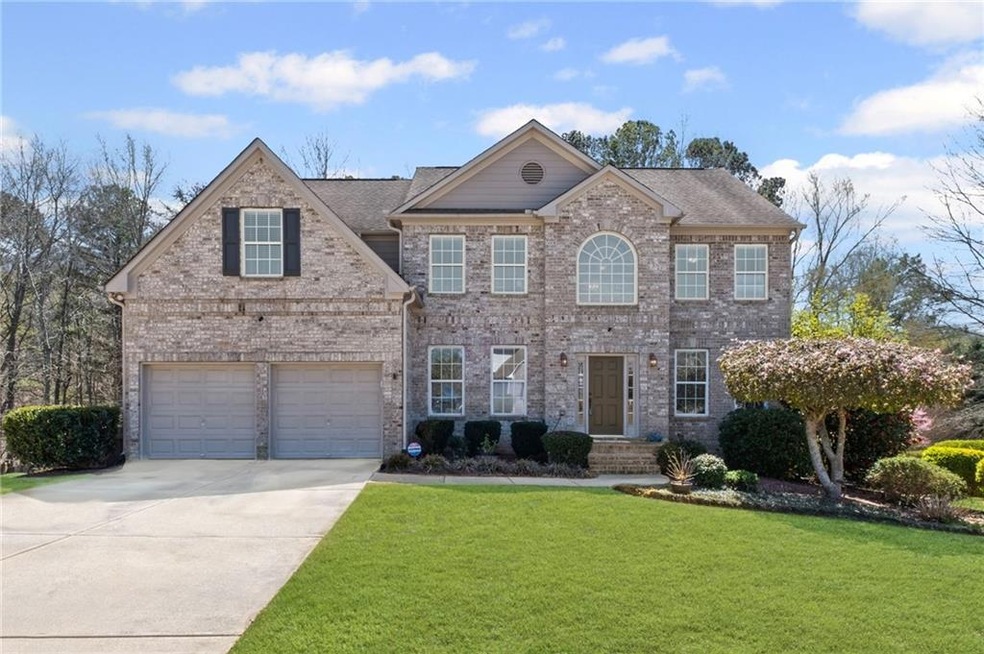 View of front facade featuring an attached garage,