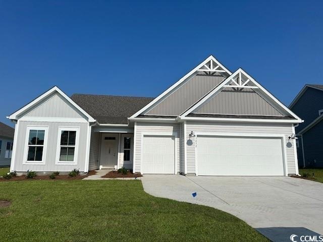 View of front of property featuring a garage and a