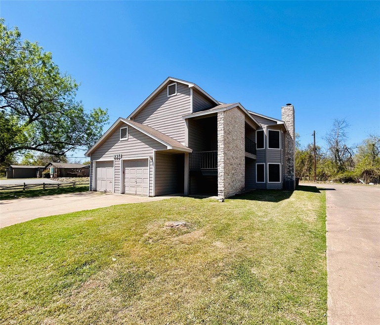 View of front of property with a chimney, a front