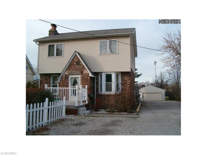 Beautilful stone/vinyl home eith 2 units behind th