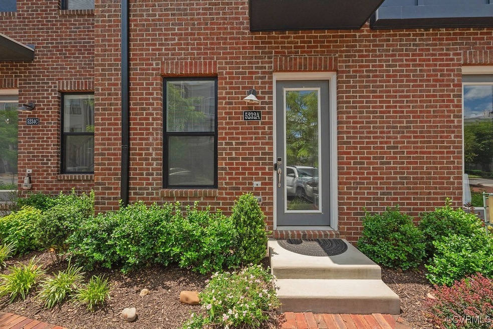 Doorway to property with brick siding