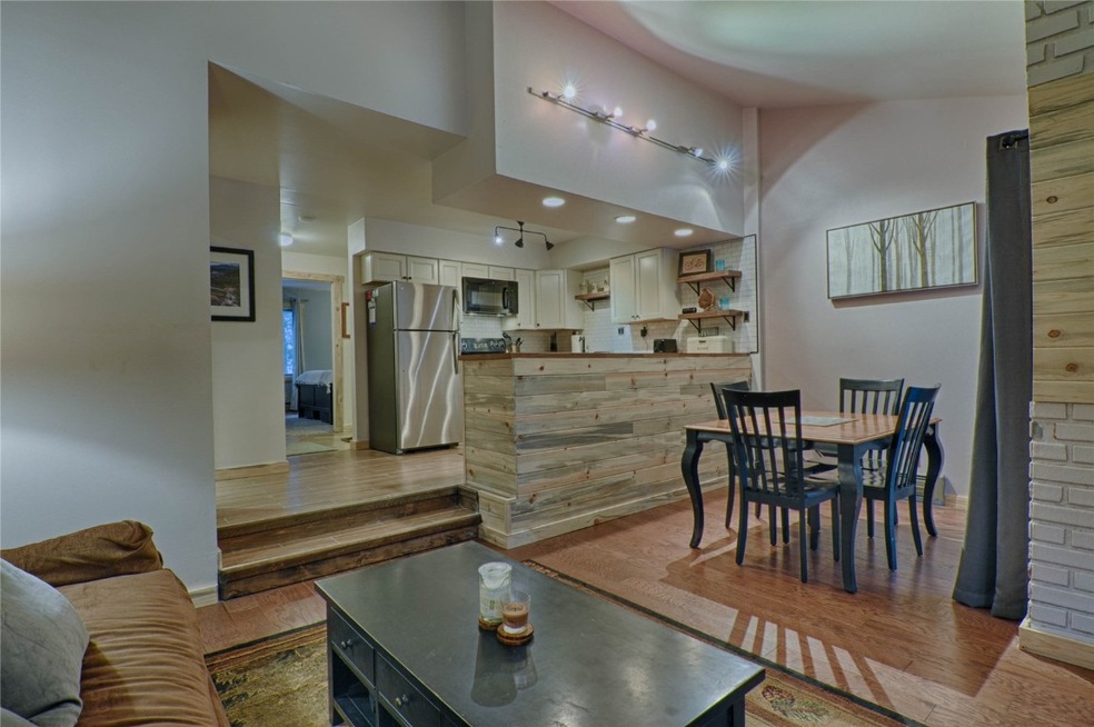 Living area featuring light wood finished floors,