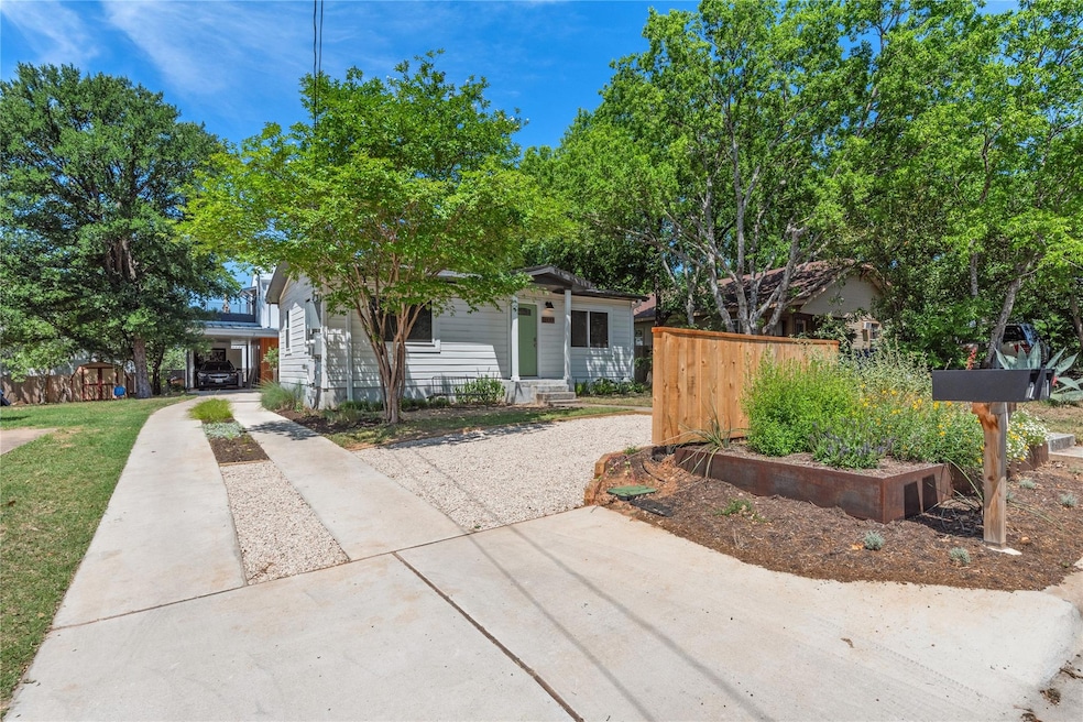 View of front of house featuring fence