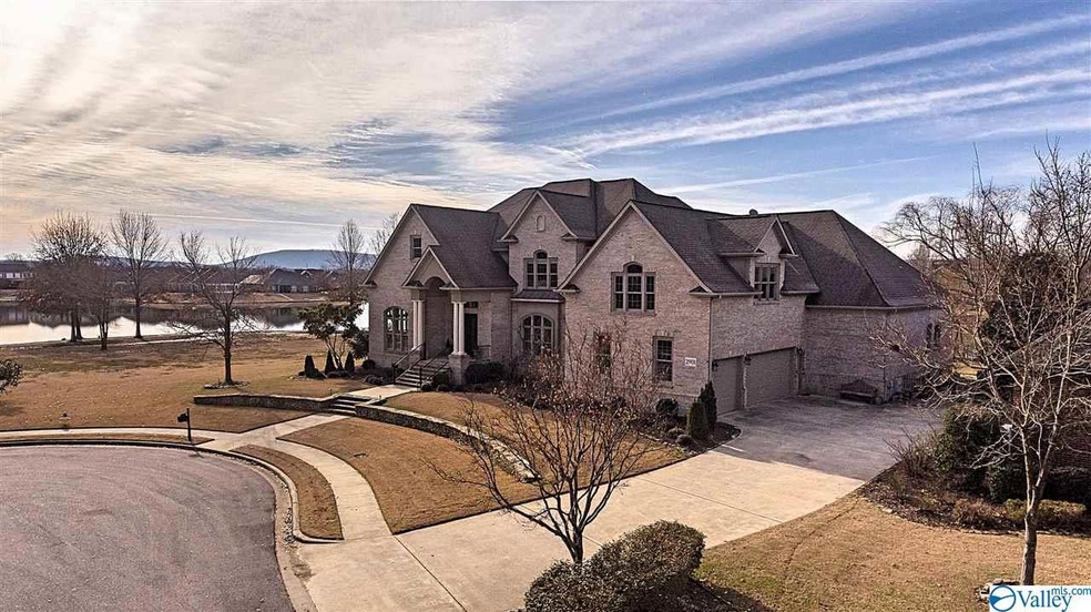 .44 Acre Lot wrapped by Lake and Mountain Views. Be sure to check out Drone Video!