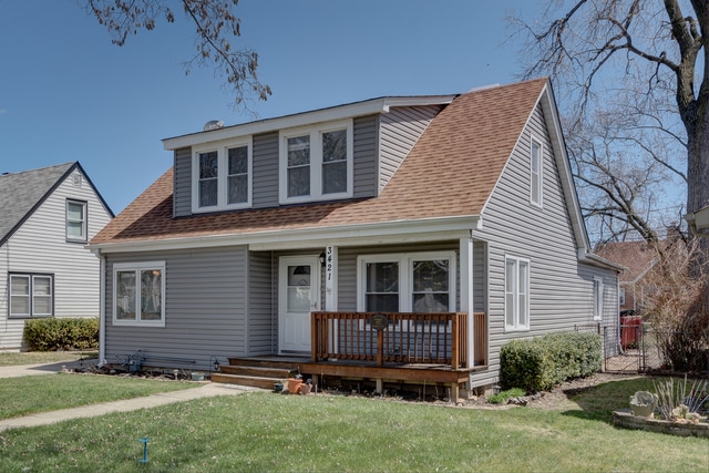 Charming cape cod with new siding and front porch