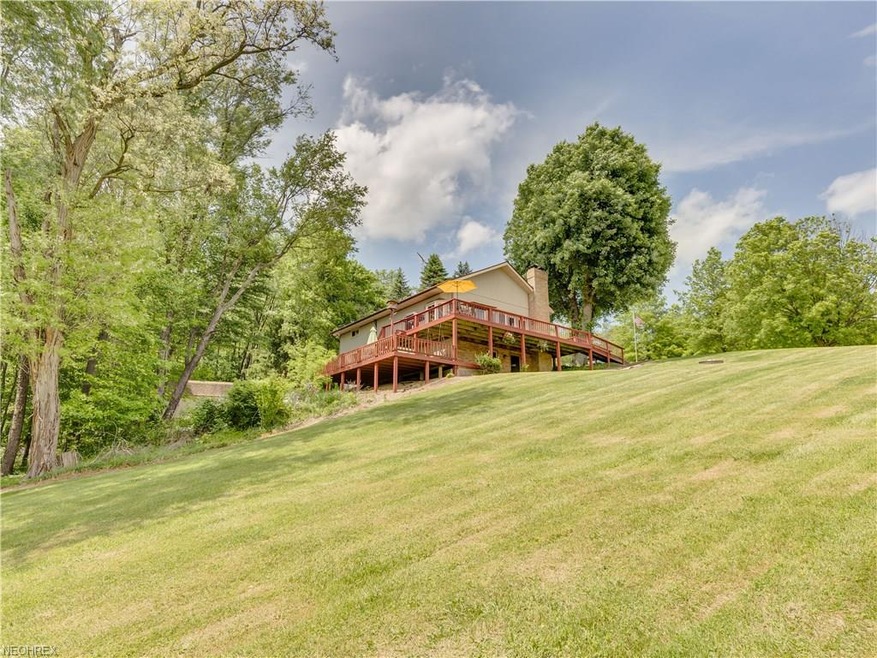 This 2.042 acre lot has grape vines, apple trees a