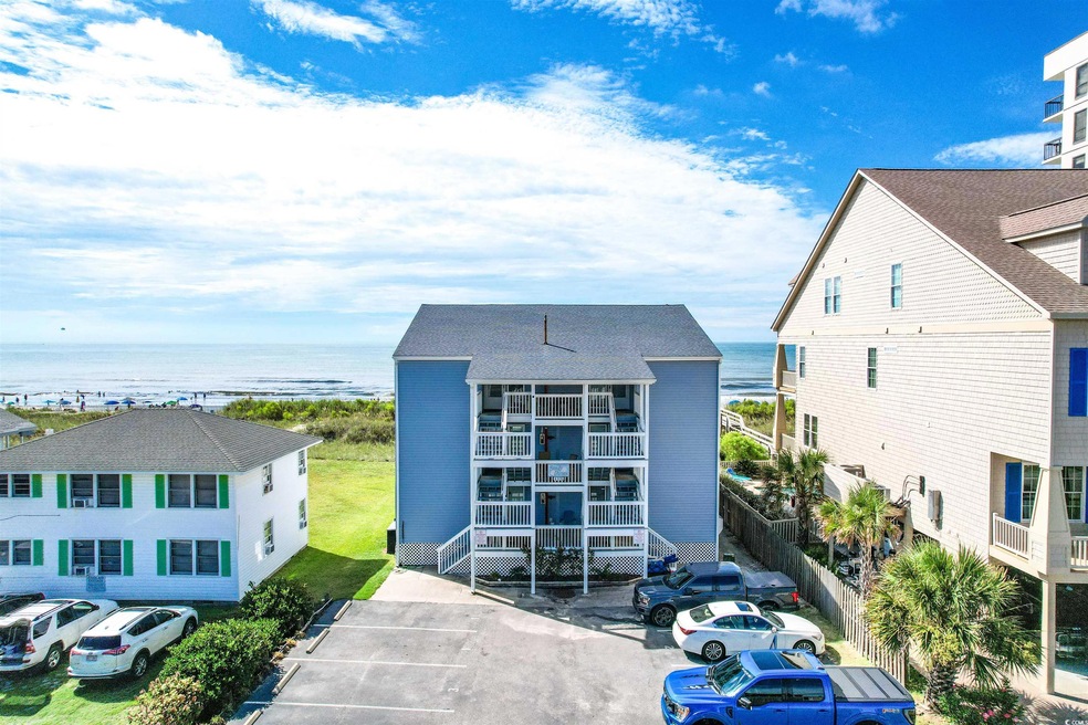 View of property with a water view