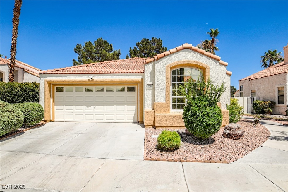 Mediterranean / spanish-style home featuring a til