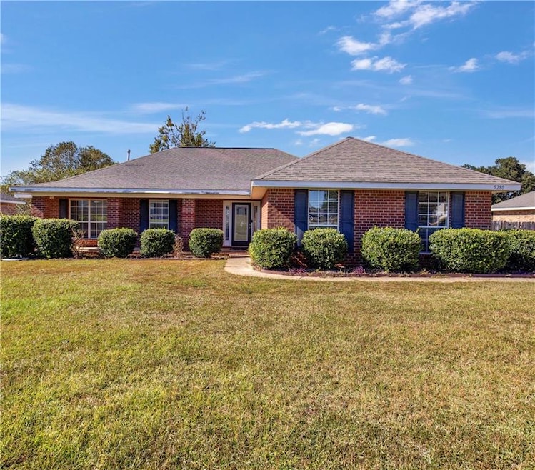 Single story home with a front yard