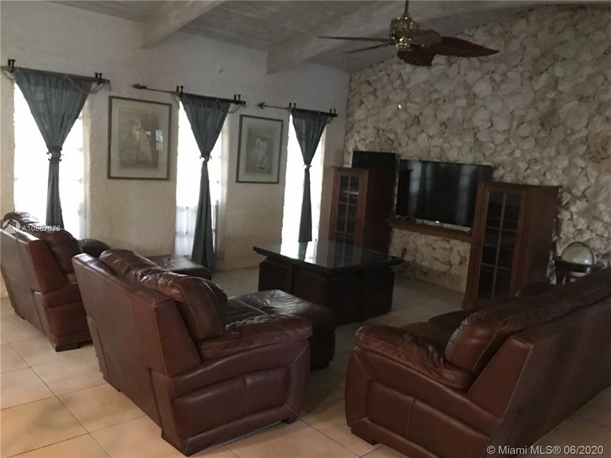 large living rom with rock walls and textured wall