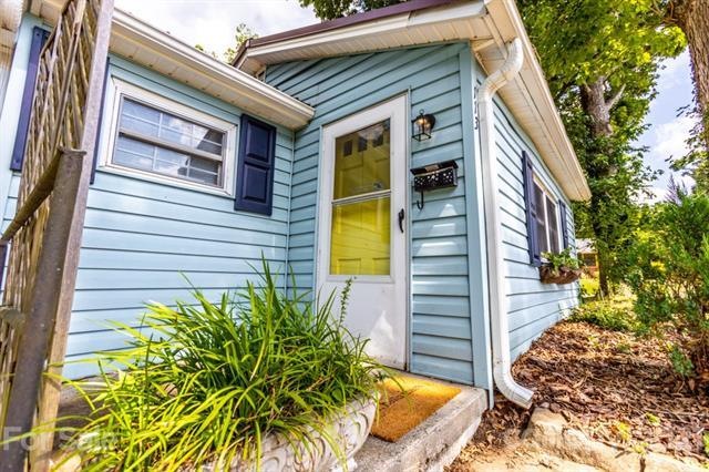 Main level living awaits in this charming bungalow in the heart of West Asheville.