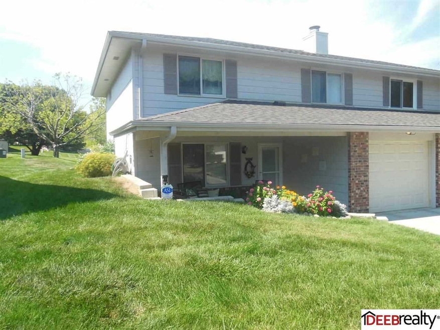 Great curb appeal!  Small retaining wall and awesome landscaping.