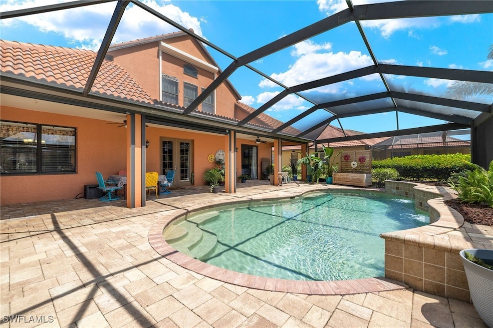 Pool with a patio, ceiling fan, and screen enclosu