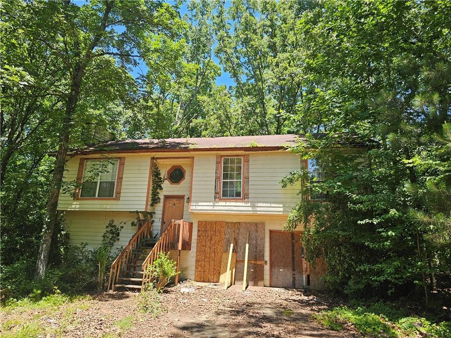 Front elevation of this split foyer home with lots