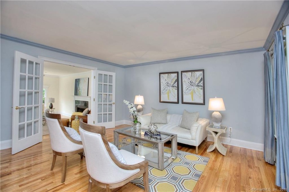 To the right, the formal living room features larg