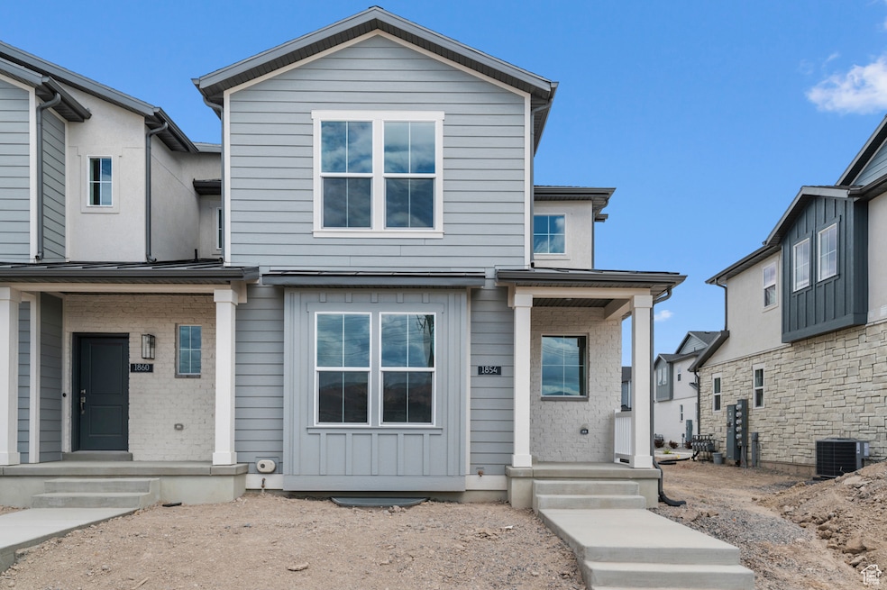 Traditional-style house with brick siding