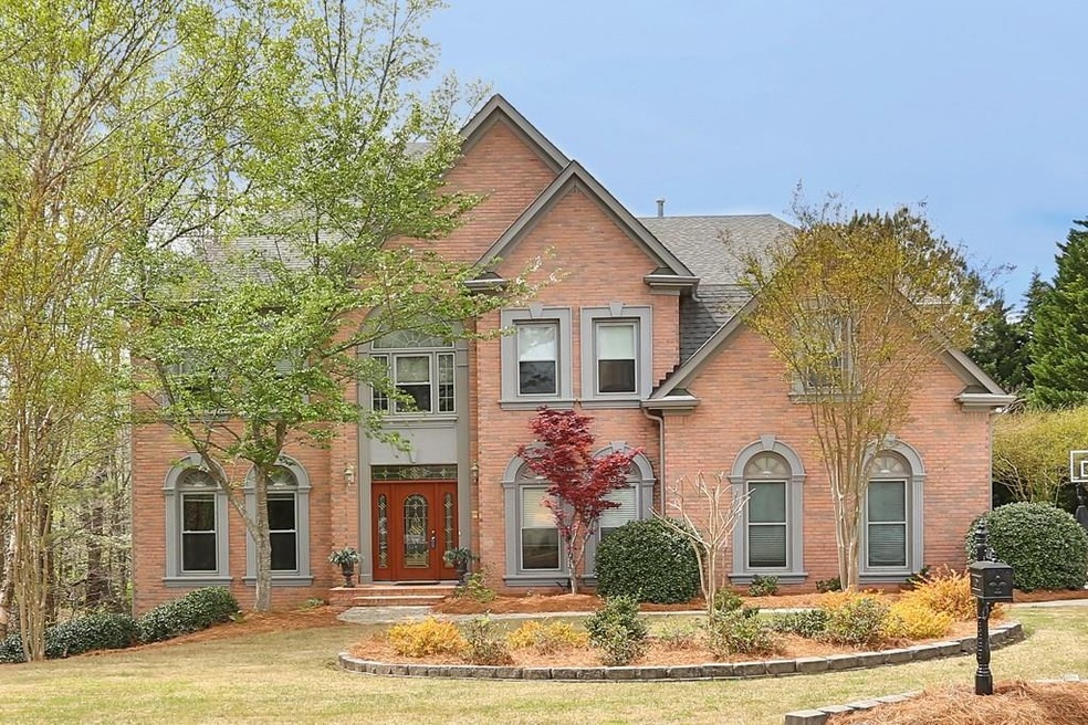 Relish country club living in this four side brick