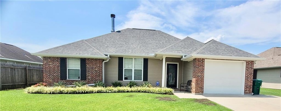Make this your HOME! Beautifully landscaped & meti