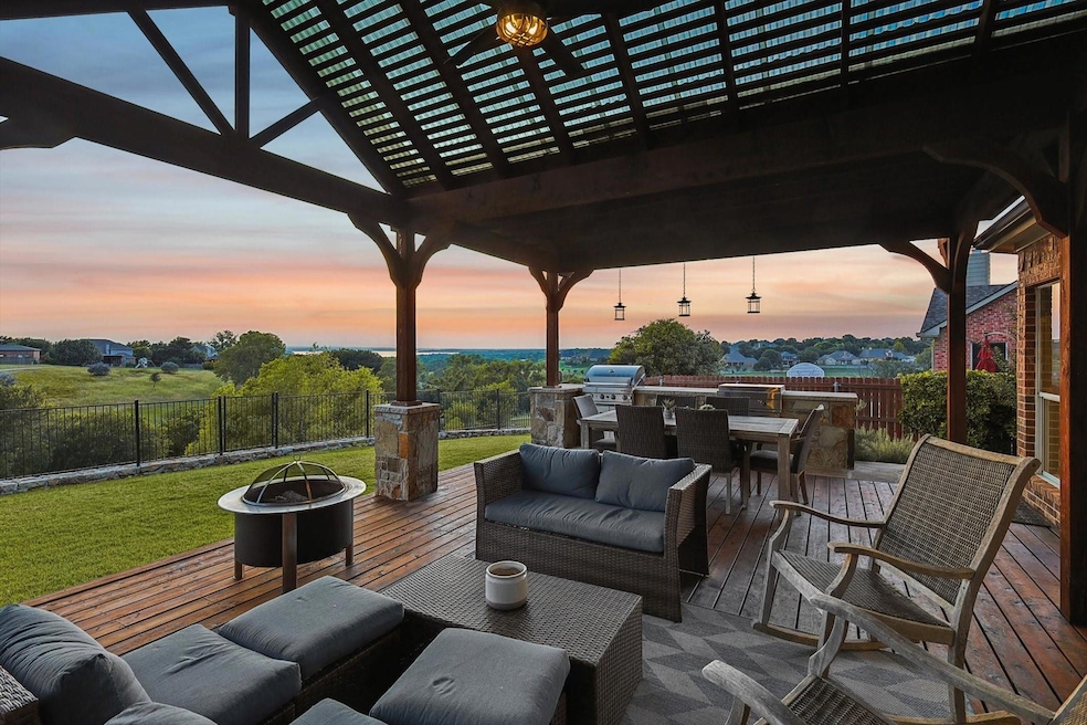 Patio terrace at dusk featuring a pergola, an outd