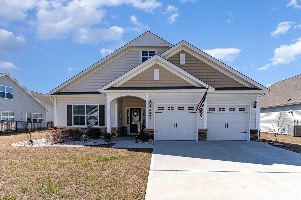 Craftsman inspired home with a garage, concrete dr