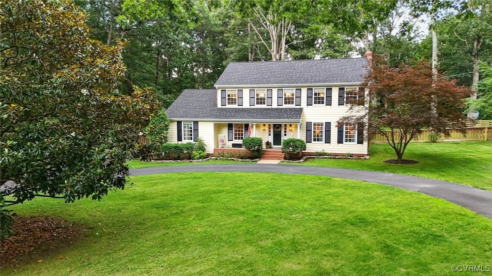 Colonial-style house with covered porch, roof with