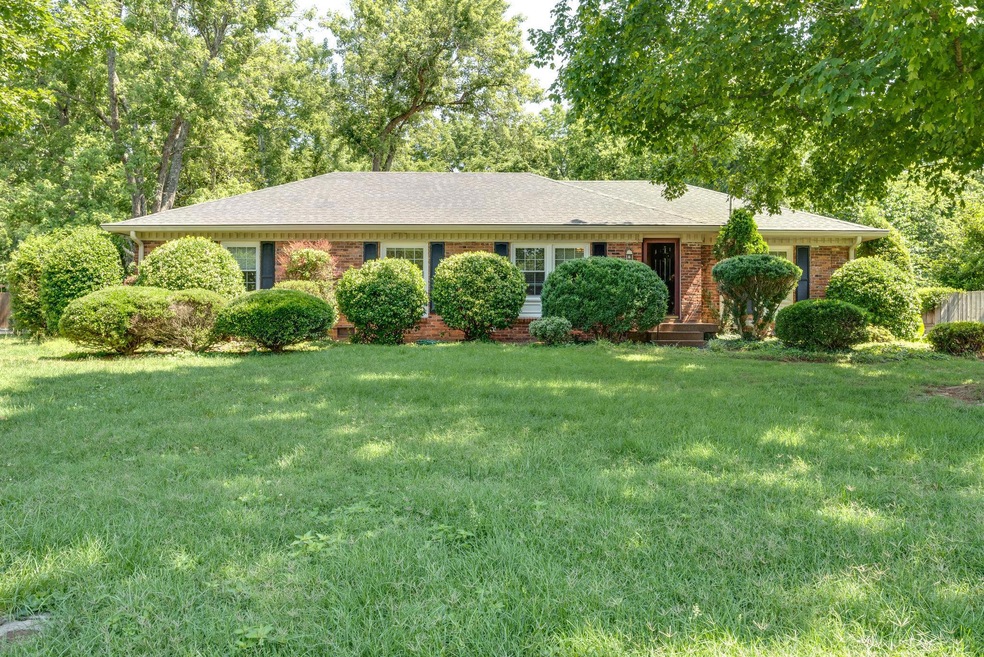 All brick on half acre lot that backs to Walnut Grove Elementary
