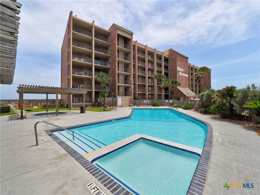 Front of Gulf Shores Condominiums with large pool