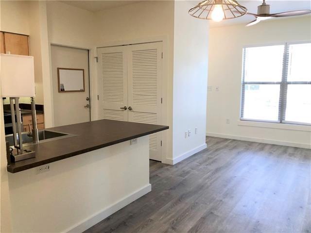 Living Room opens to dining & kitchen.