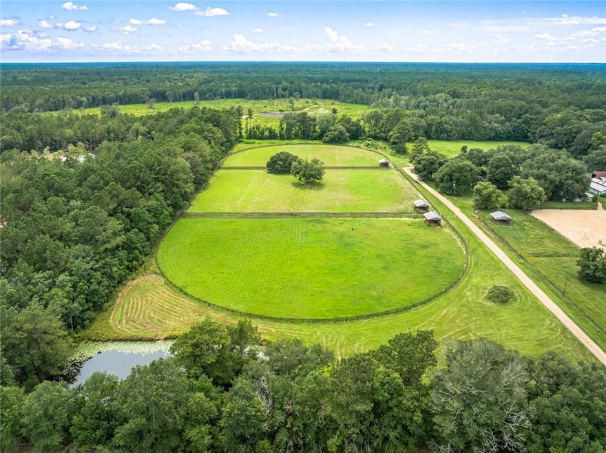10.21 Acres with 3 covered structures.