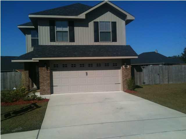 Front of House with fully fenced yard