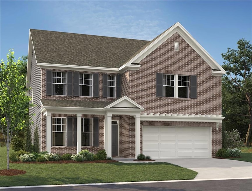 Traditional home with a garage, brick siding, driveway, a front yard, and roof with shingles